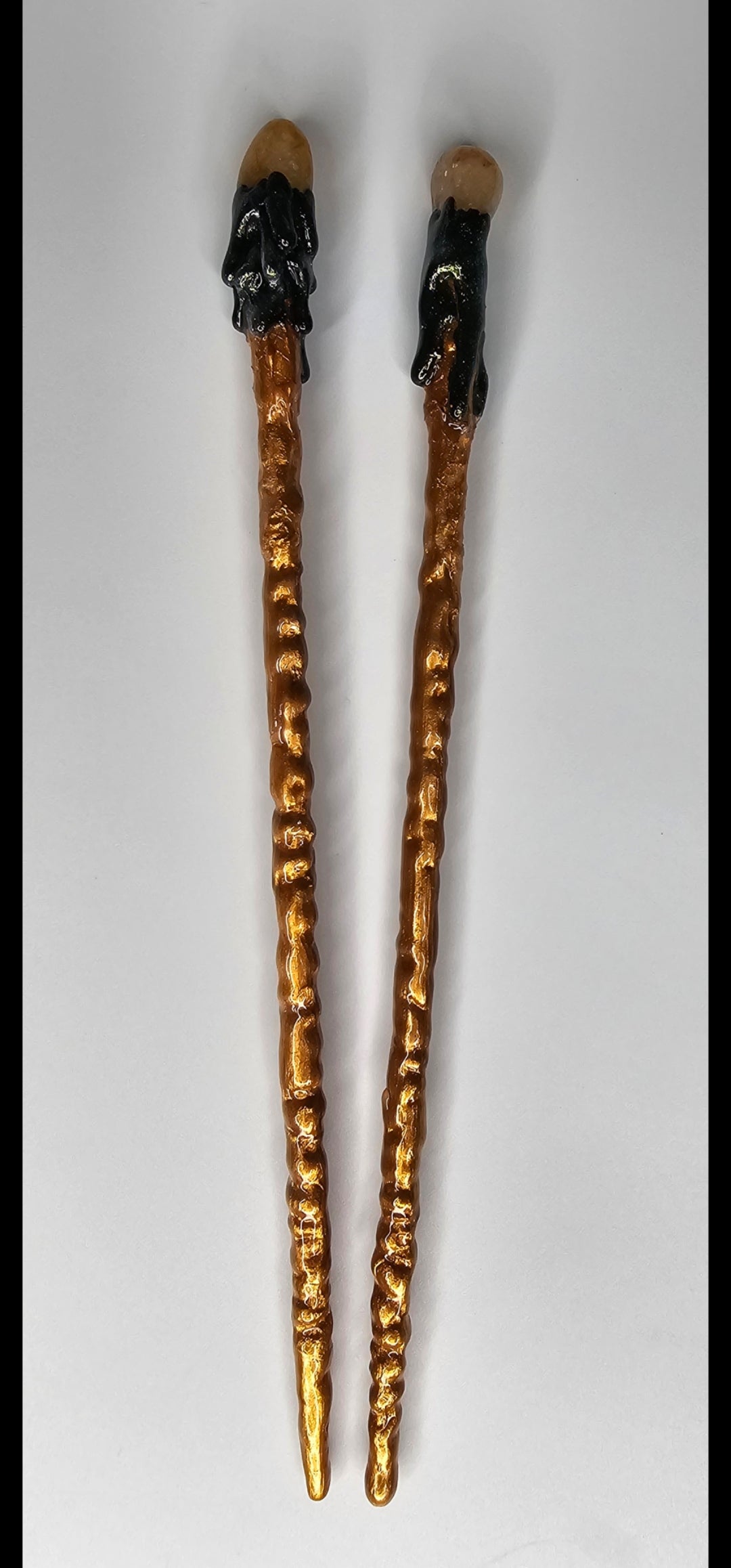 Golden healer manifesting one hair chopstick